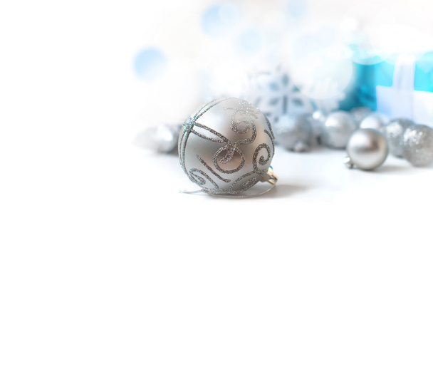 silver Christmas balls and gifts on wooden table - Photo, Image