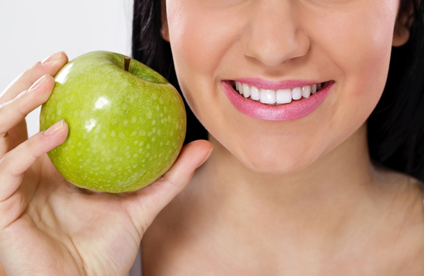 Great smile and green apple - 写真・画像