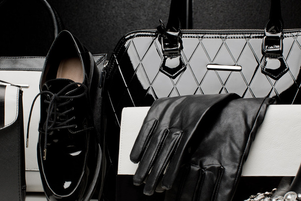 fashionable set of women's accessories on black background - Fotó, kép