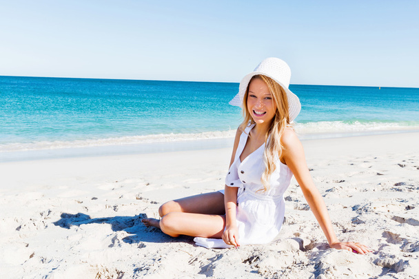 Young woman relaxing on the beach - Photo, Image