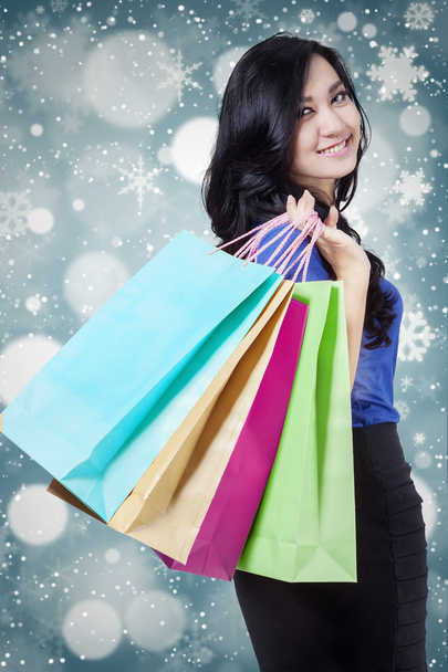 Lovely shopper with winter background - Zdjęcie, obraz