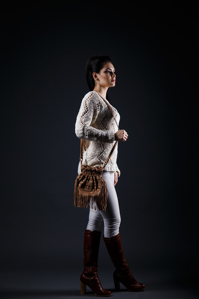 beautiful brunette girl in beige sweater and brown bag - Foto, afbeelding