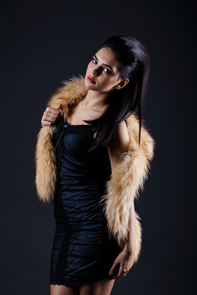 Portrait of a seductive lady in fur coat - Photo, image
