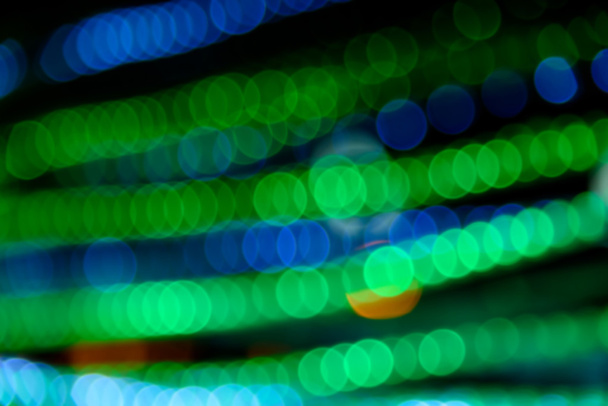 Abstract circular natural green and blue light bokeh background - 写真・画像