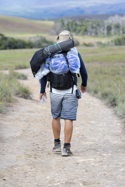 European man tourist walking with backpack, Roraima, Venezuela - 写真・画像