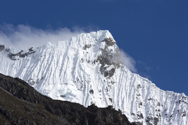 Snow covered mountain peak and blue sky, Cordillera Blanca, Peru - Photo, Image