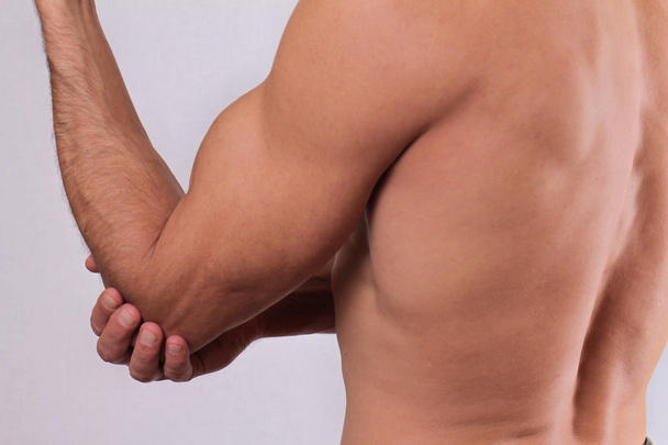 Man With Pain In Elbow. Pain relief concept - Foto, imagen