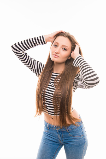 Pretty girl in striped blouse posing on white background - Фото, изображение
