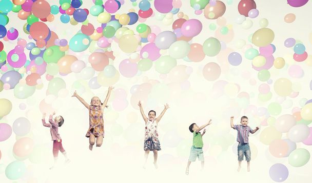 Playful children catch balloons - Photo, Image