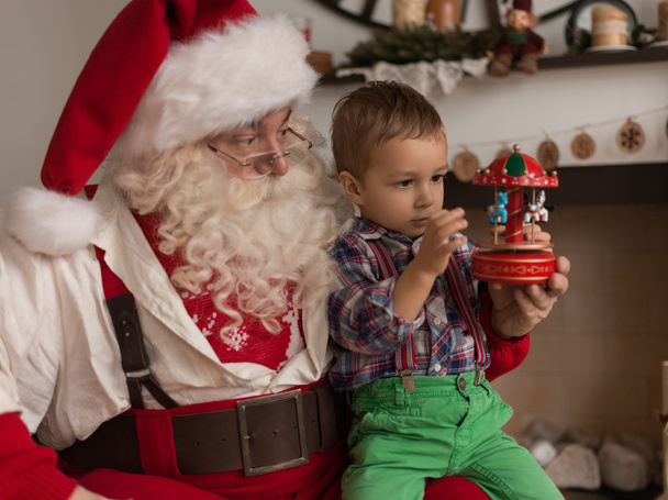 Santa Claus Playing  with Child - Фото, зображення