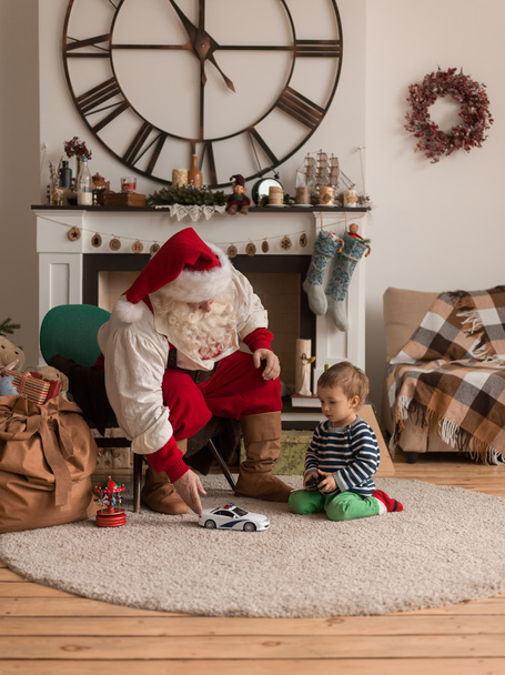Santa Claus Playing  with Child - 写真・画像