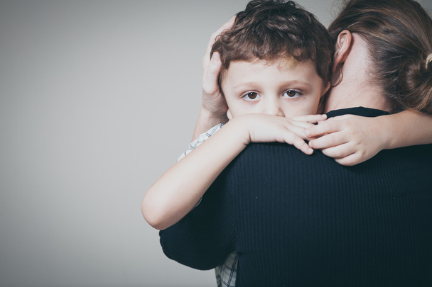 sad son hugging his mother - Photo, image