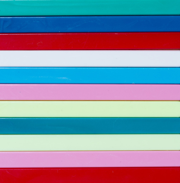 Színes csíkos háttér. Különböző színű műanyag rúd - Fotó, kép