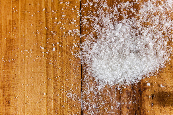 Granulated White Sugar Spill over Wooden Background - Photo, image