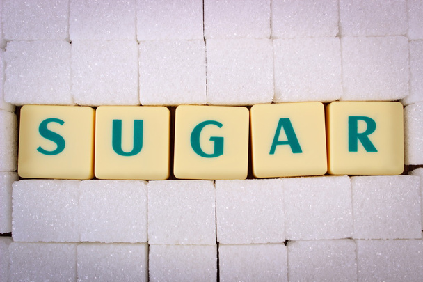 Cubes of sugar and text sugar, ingredient for cooking - Photo, image