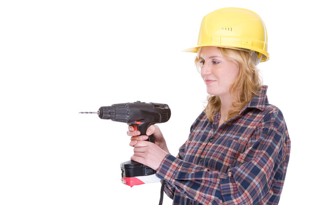 Craftswoman with drill machine - Foto, afbeelding