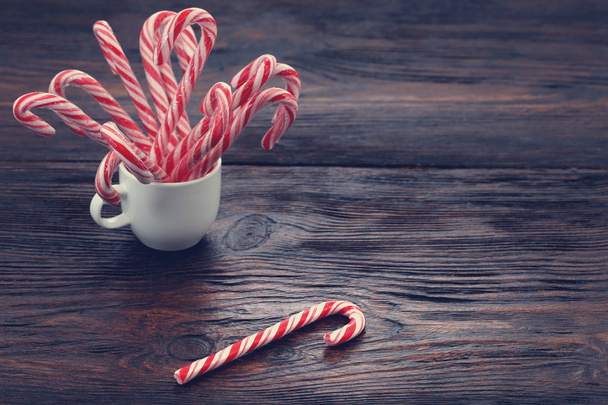Candy canes on a wooden board - Foto, Imagem