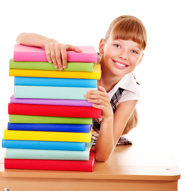 School child holding stack of books. - Фото, изображение