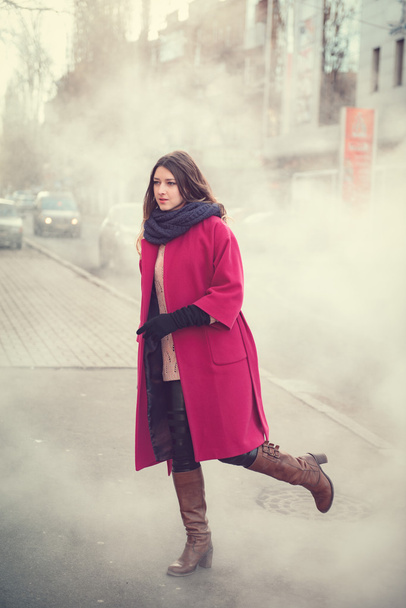 Girl in coat walking - Фото, зображення
