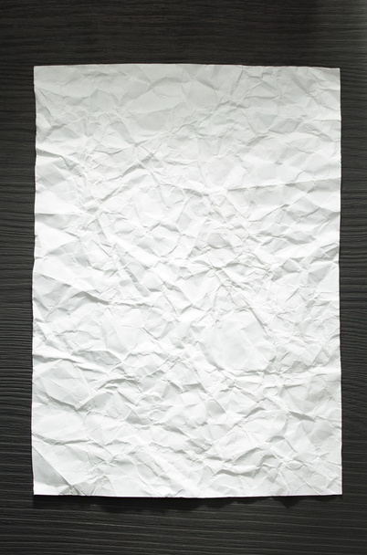 wrinkled paper at wood - Photo, image