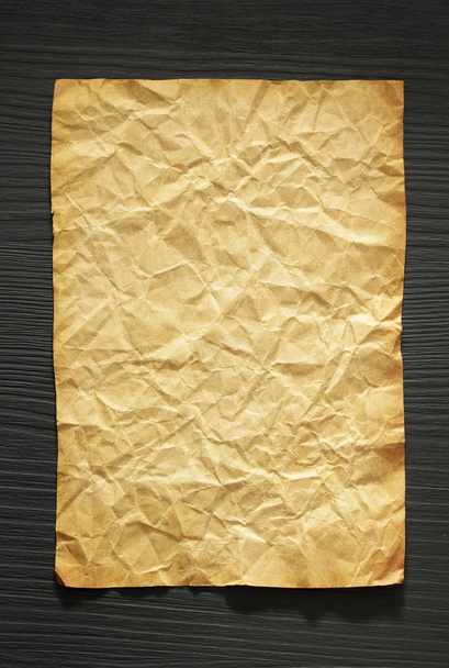 wrinkled paper at wood - Photo, Image