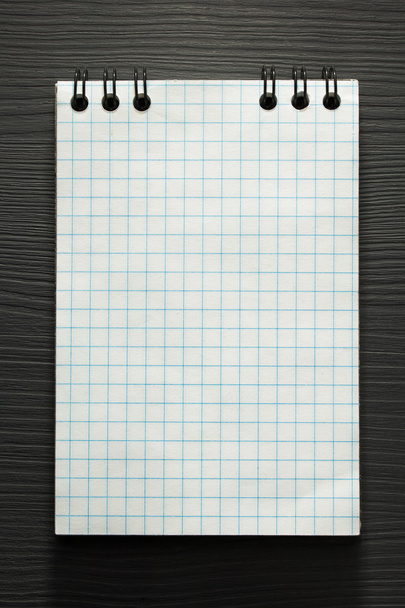 checked notebook  on wood - Foto, Imagem