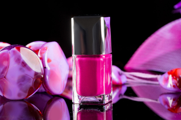 magenta nail polish on  background of womens accessories - 写真・画像