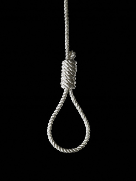 loop of white rope on a black background - Fotó, kép