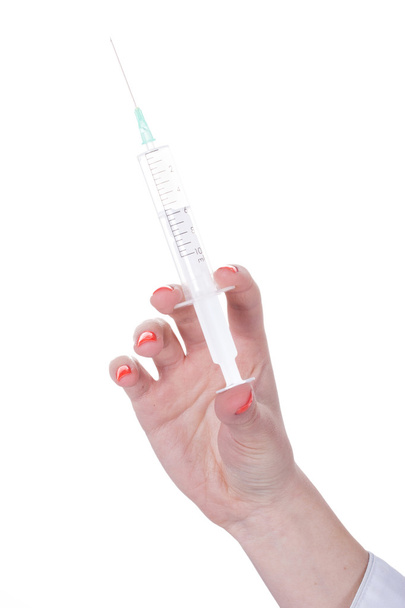 Hand brings syringe - Foto, afbeelding