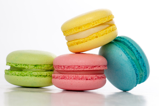 Collection of brightly colored French macarons on white backgrou - Foto, imagen