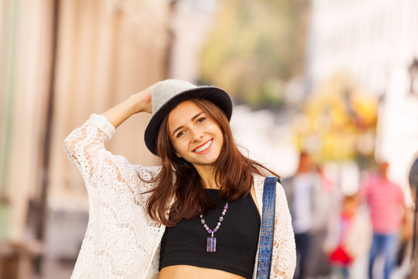 Portrait of girl with hat on the street during - Φωτογραφία, εικόνα