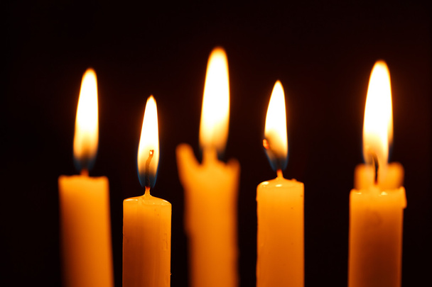 Many burning candles on black - Foto, Imagem