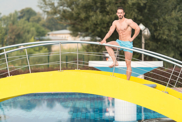 Muscular Man In Underwear Resting At Swimming Pool - Foto, Imagem