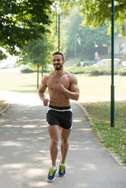 Bodybuilder Fitness Jogging Workout Wellness Concept - Valokuva, kuva
