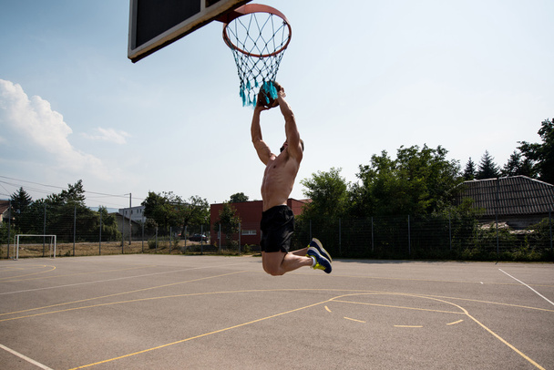 Basketball Player Shooting In A Playground - Foto, imagen