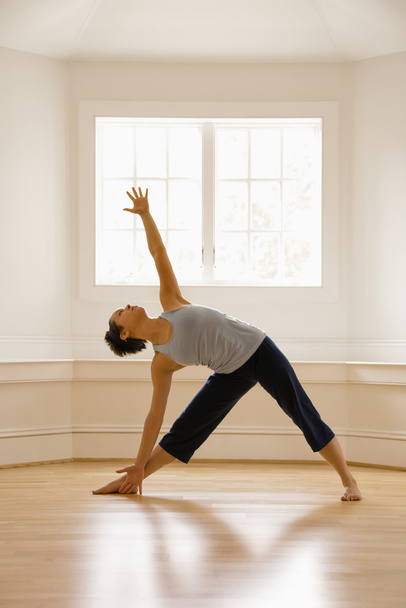 Yoga triangle pose - Фото, изображение