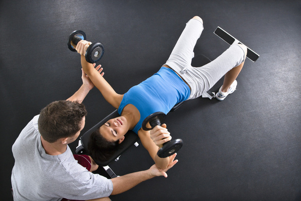 Woman lifting weights - Zdjęcie, obraz