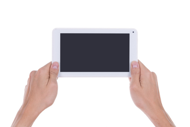 hand met kleine tablet-computer leeg scherm - Foto, afbeelding