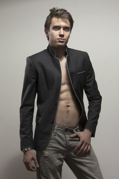 Young good-looking model  in dark suite  with naked torso - Foto, Imagen