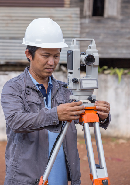 Engineers use tacheometer or theodolite for survey line columns  - Photo, Image