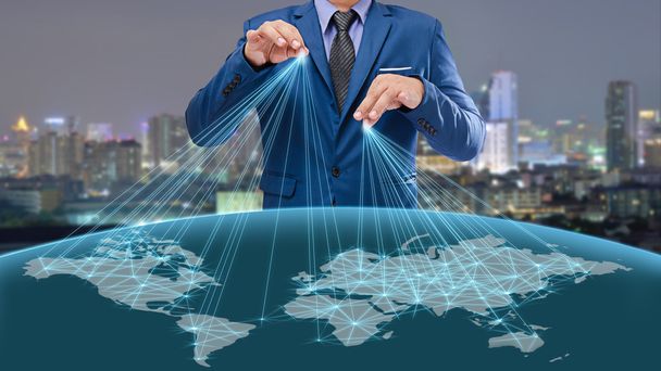 businessman control the world with night city background - Photo, image