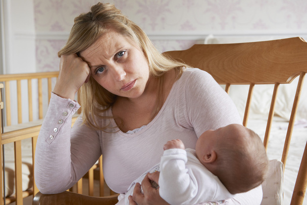 Tired Mother Suffering With Post Natal Depression - 写真・画像