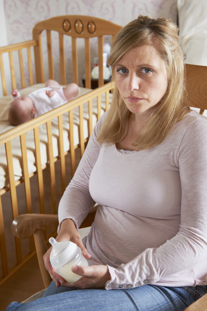 Mother In Nursery With Baby Suffering From Post Natal Depression - Фото, изображение