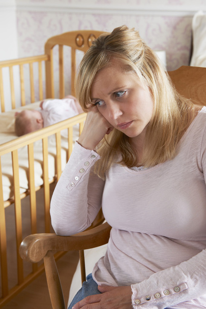 Mother In Nursery Suffering From Post Natal Depression - Foto, imagen