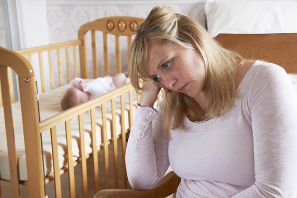 Mother In Nursery Suffering From Post Natal Depression - Fotografie, Obrázek