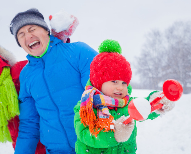 Family having fun in snow - Photo, Image