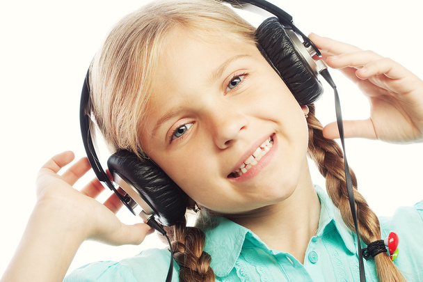 Beautiful happy little girl with headphones - Foto, Imagem