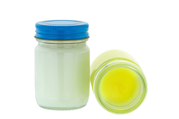 Jars of different formulas of Thai balm in yellow and white - Фото, изображение