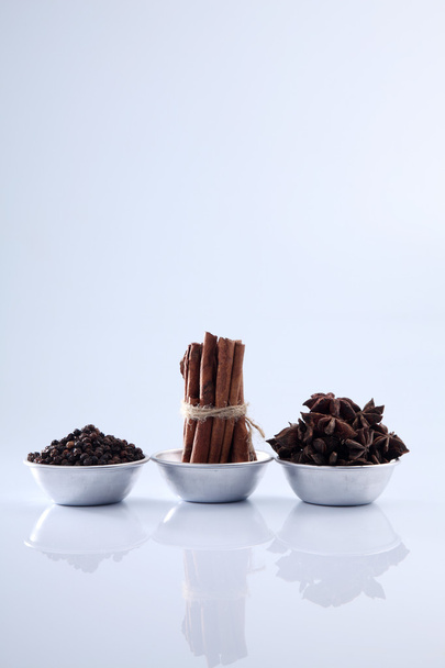 aromatic spices in saucers - Foto, afbeelding
