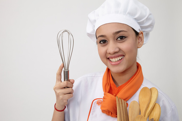 Indian woman in chef uniform - Foto, afbeelding